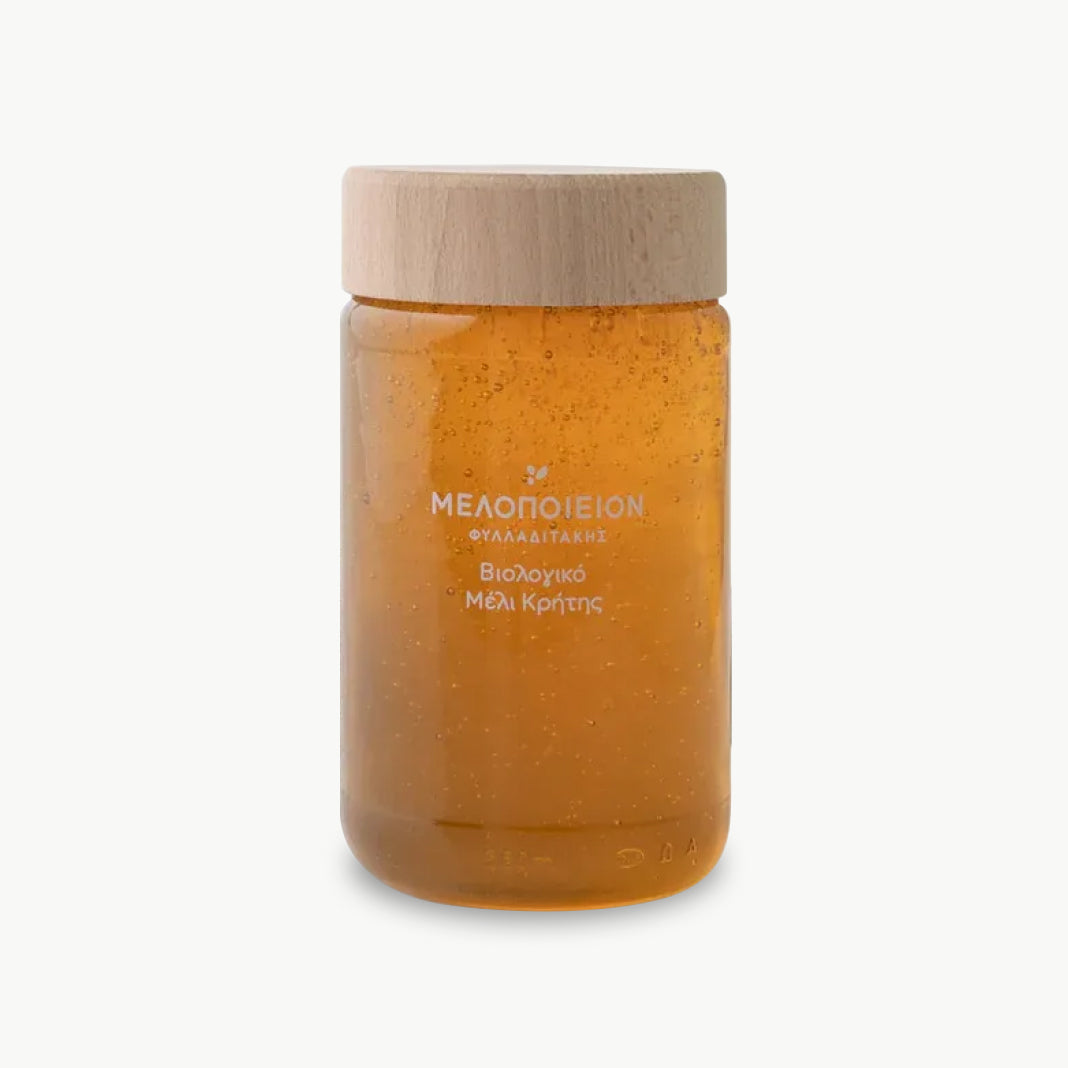 Organic raw Greek honey in glass jar
